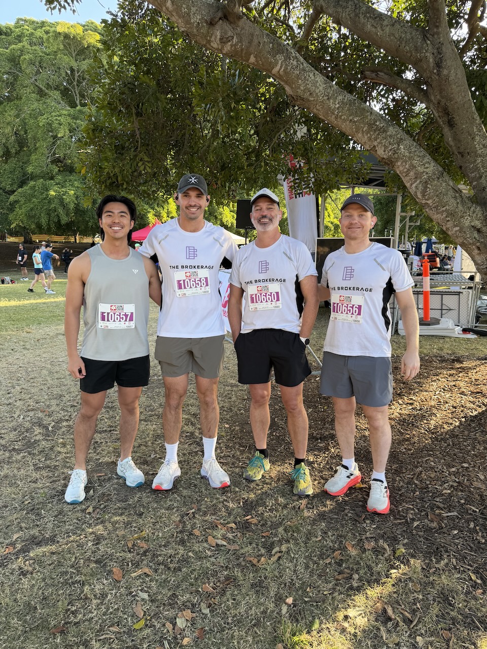 Four members of The Brokerage in branded running shirts before the Run2Cure 10km start