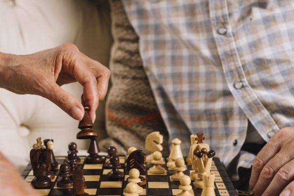 close-up-couple-playing-chess