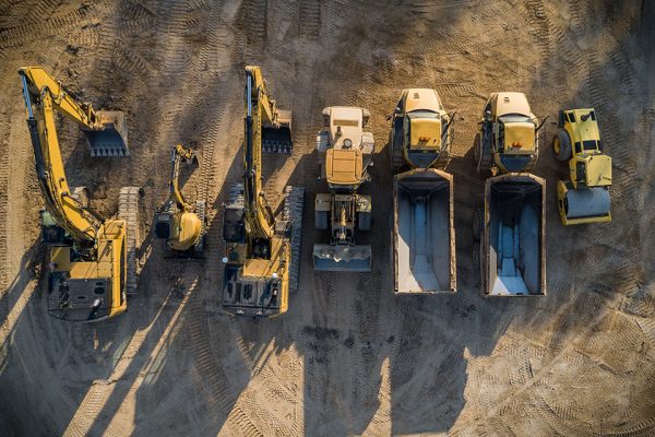 Construction dirt moving equipment lined up for the night.